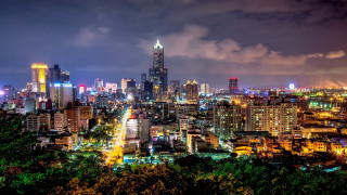 City skyline night lights trees - free city wallpaper