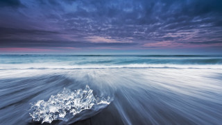 Beach waves clouds rock sky - a picture of a beach free wallpaper