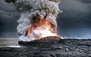 Smoke plume volcano rocky beach - a volcano free wallpaper