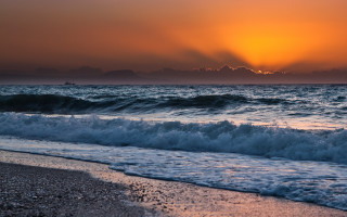 Sunset ocean waves boat mountains - the distance free wallpaper
