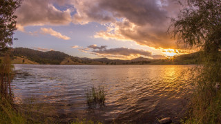 Lake sunset clouds trees bushes - a sunset in the background free wallpaper
