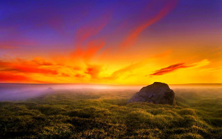 Sunset grassy field rock red 2 - sky in the background free wallpaper