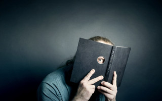 Man hiding face book hole - surreal photography free wallpaper