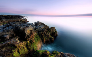 Rocky cliff lake sunset pink - a rocky cliff free wallpaper