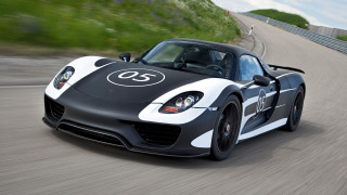 Black white sports car driving 2 - plasticien free wallpaper