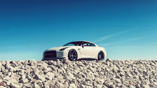 White car rocky surface tilt - hard edge free wallpaper