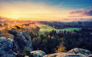Scenic valley trees mountains sunset - a scenic view of a valley free wallpaper