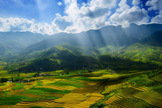 Valley mountains sun rays clouds - a view of a valley free wallpaper