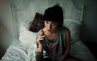 Woman smoking bed white comforter - a woman smoking free wallpaper
