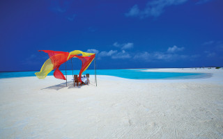 Beach umbrella couple ocean sky - a beach near the ocean free wallpaper