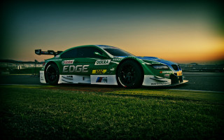 Green race car sunset tiltshift - a race track free wallpaper