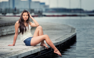 Woman dock water city shorts - the background and a body of water free wallpaper