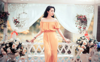 Woman yellow dress balcony flowers - a white bench free wallpaper