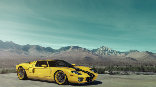 Yellow sports car mountain scape - f 8 aperture free wallpaper