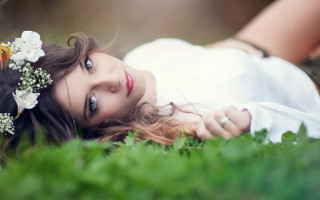 Woman flower grass portrait blurry - her hair and a flower free wallpaper