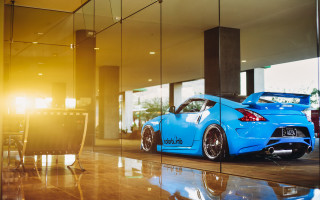 Blue sports car glass wall - a blue sports car free wallpaper for desktop