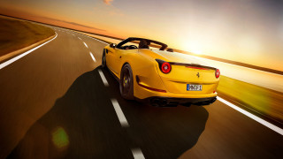 Yellow sports car backlit sunset 2 - a yellow sports car free wallpaper
