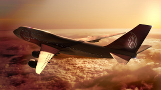 Jetliner red white tail flying 2 - a cloudy sky above the clouds free wallpaper