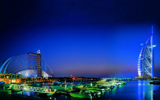 City skyline boats night tall - a tall building in the background free wallpaper