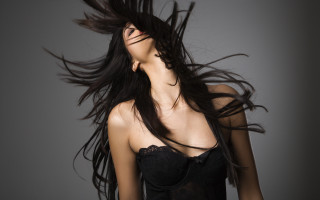 Woman blowing hair black dress 2 - flowing hair free wallpaper