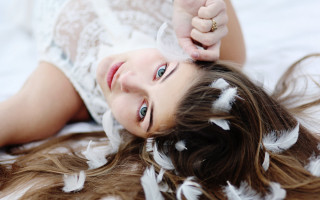 Woman feathers ring portrait blurry - claire dalby free wallpaper