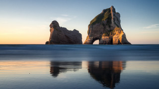 Rock formation reflection ocean sky - the water and a sky background free wallpaper