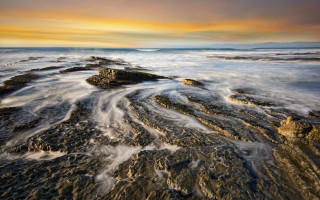 Rocky beach sunset waves colorful - a rocky beach free wallpaper