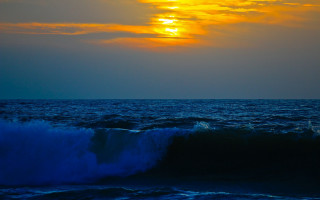 Large wave sunset ocean boat - a surfboard free wallpaper