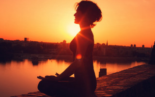 Woman dock sunset cityscape backlighting - the sun setting behind her free wallpaper