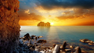 Sunset rocky beach rock formation - a sunset over a rocky beach free wallpaper