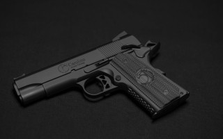 Gun laser engraved black background - design free wallpaper