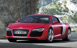 Red sports car cliff mountain - a mountain in the background free wallpaper for desktop