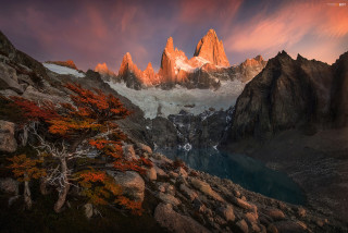 Mountain lake trees sunset fire - the foreground and a sunset in the background free wallpaper