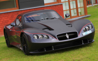 Black sports car red brick - a red brick wall behind free wallpaper