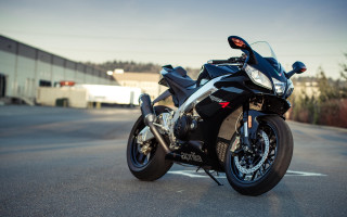 Motorcycle road building trees photorealism - a building in the background free wallpaper