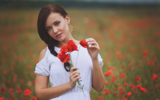 Woman flower field serious portrait - serious free wallpaper for desktop