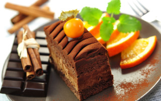 Chocolate cake plate oranges cinnamon - a piece of chocolate cake free wallpaper