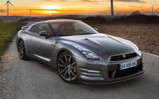 Silver sports car wind turbine - a windmill in the background free wallpaper