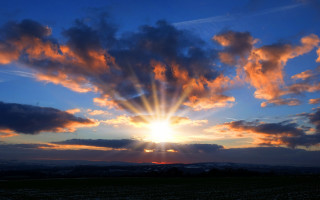 Sunset clouds bright sun dusk - a bright sun free wallpaper