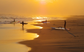 Beach sunset surfboards impressionist children - golden hour free wallpaper