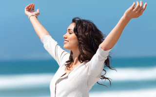 Woman arms up beach blue - woman free wallpaper