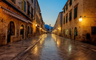 Wet street night buildings cityscape - both side of it free wallpaper