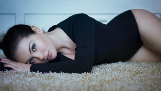 Woman black dress heels laying - a black dress and heels free wallpaper