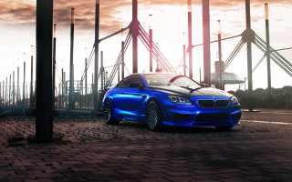 Blue car structure sky clouds - a blue car free wallpaper