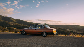 Mountain road sunset car window - the side of a road near a mountain range free wallpaper