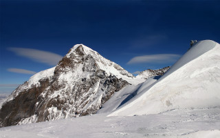Snowy mountain skier blue sky 2 - ski free wallpaper