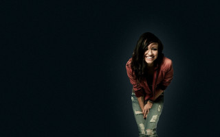 Woman smiling dark background jacket - fine art free wallpaper