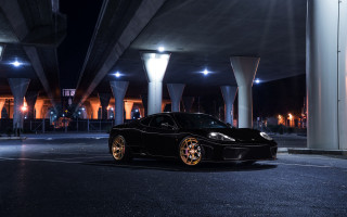Black sports car night city - a bridge in the background free wallpaper