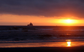 Sunset ocean lighthouse cloud beach - a lighthouse in the distance free wallpaper