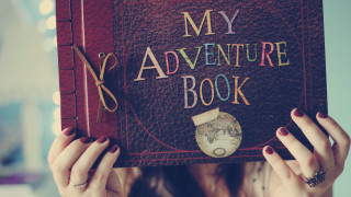 Woman holding book world map - a woman holding free wallpaper
